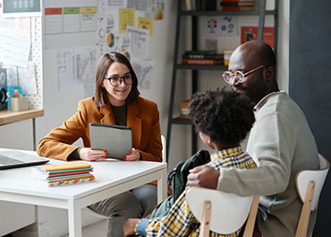 A parenting facilitator meeting with a parent and child, providing guidance for high-conflict divorces