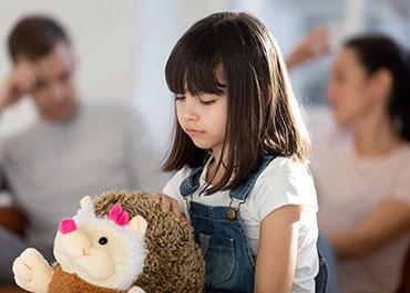 A child with a stuffed toy during a child custody dispute